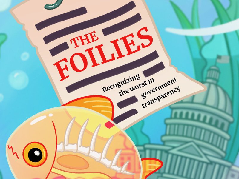 A redacted document labeled The Foilies hangs on a fishing hook inside a fishbowl, where there is a small Capitol building and a transparent fish.