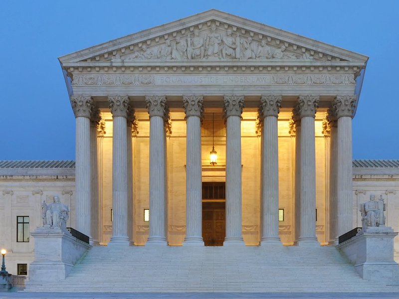 A picture of the Supreme Court building at dawn