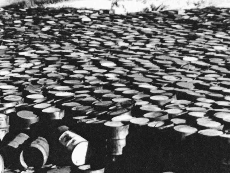 A photo taken in 1960 of deteriorating steel drums containing radioactive residues near Coldwater Creek, by the Mallinckrodt-St. Louis Sites Task Force Working Group (State Historical Society of Miss