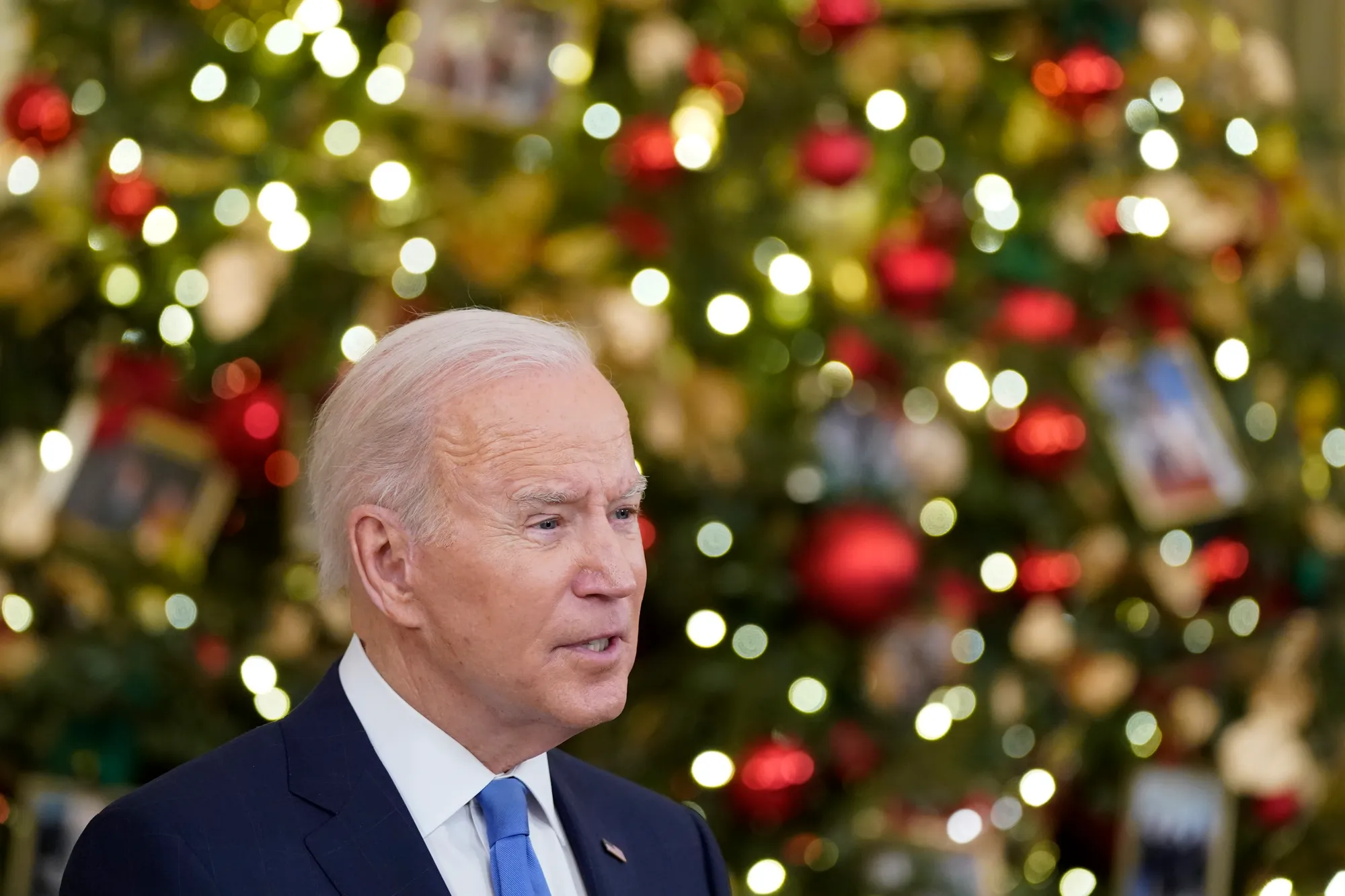 President Joe Biden speaks about the COVID-19 response and vaccinations on Tuesday, Dec. 21, 2021, in the State Dining Room of the White House in Washington. 