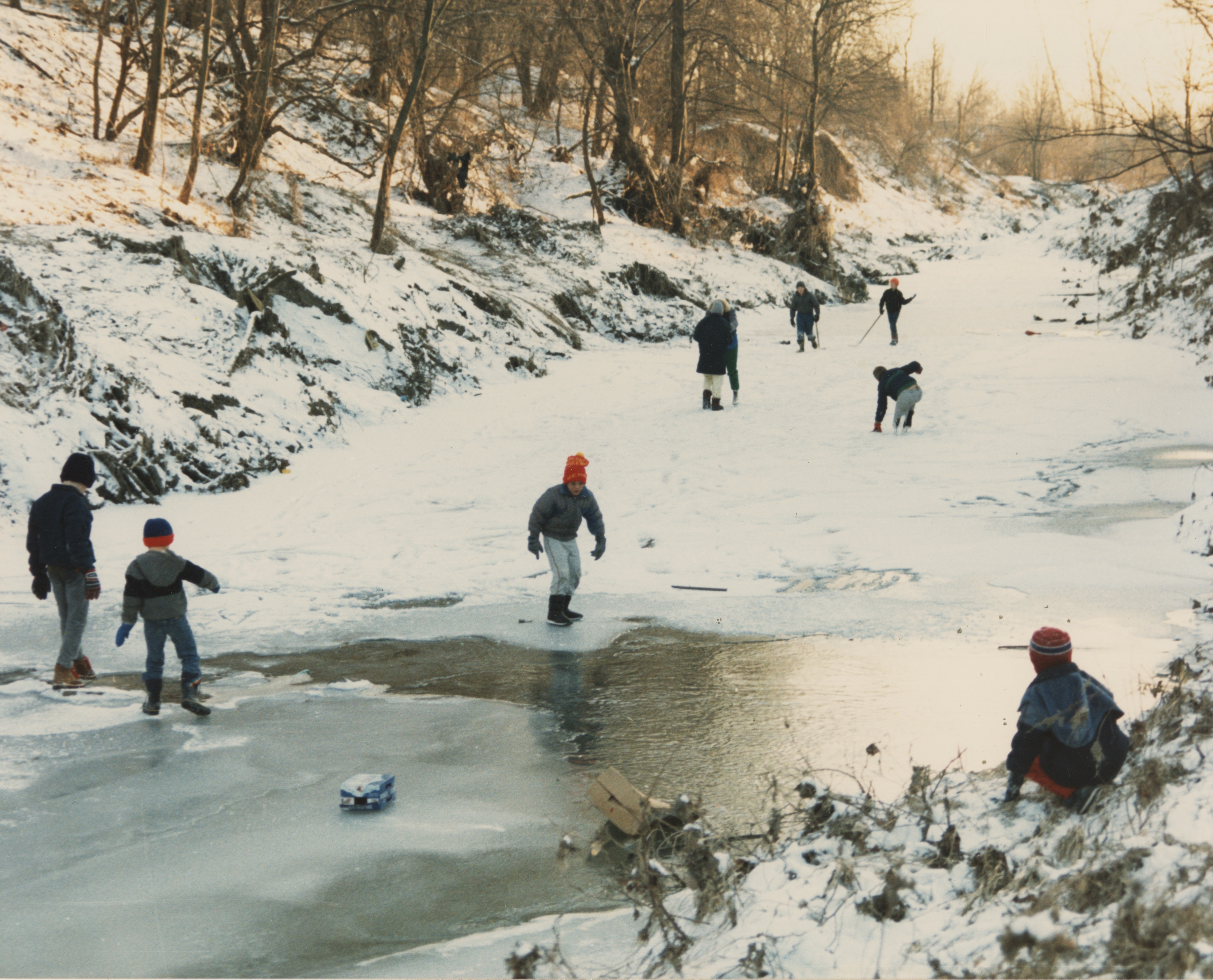 An undated photo from the 1980s, of children playing in a frozen-over Coldwater Creek. The photo is from a scrapbook kept by Sandy Delcoure, who lived on Willow Creek in Florissant and donated the scrapbook to the Kay Drey Mallinckrodt Collection. (State Historical Society of Missouri, Kay Drey Mallinckrodt Collection, 1943-2006.)